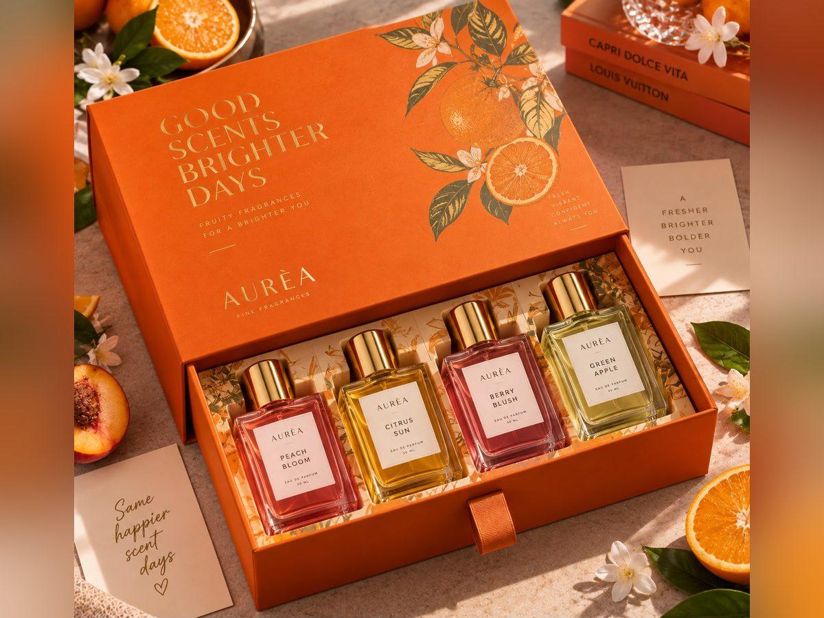 Orange illustrated drawer box holding a row of fragrance bottles