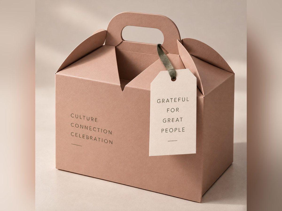 Gable-top carry carton with a die-cut handle and a printed swing tag