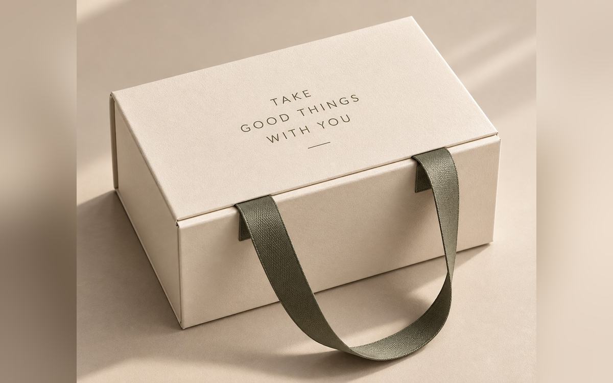 Apparel packaging: a cream rigid box with a ribbon pull